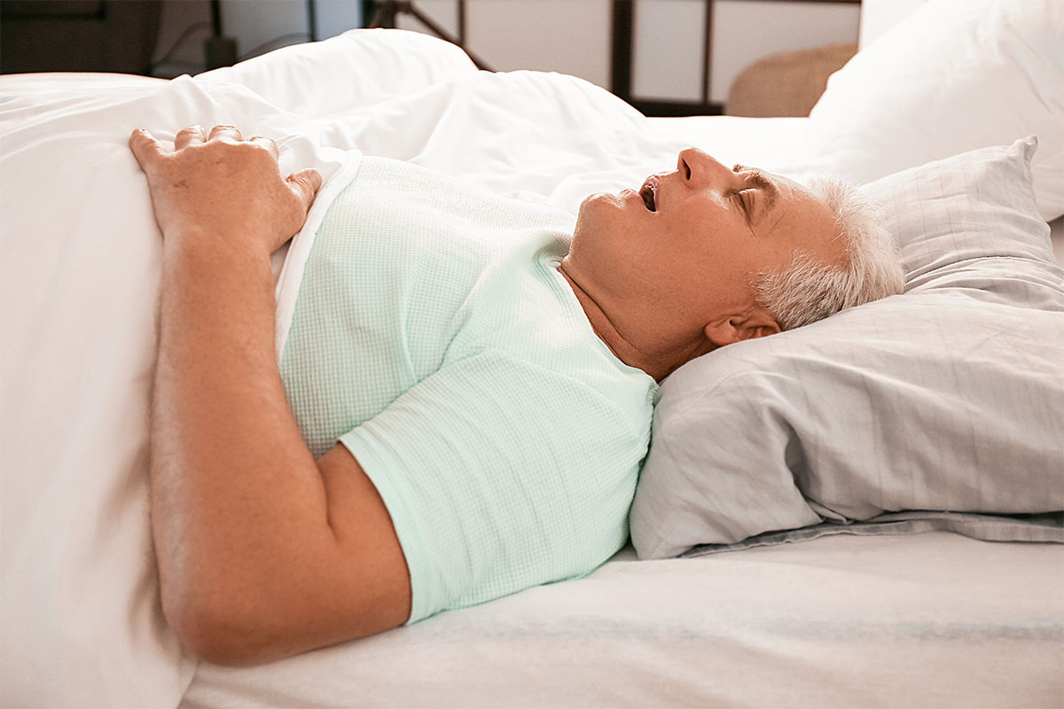 Man sleeping on his back snoring